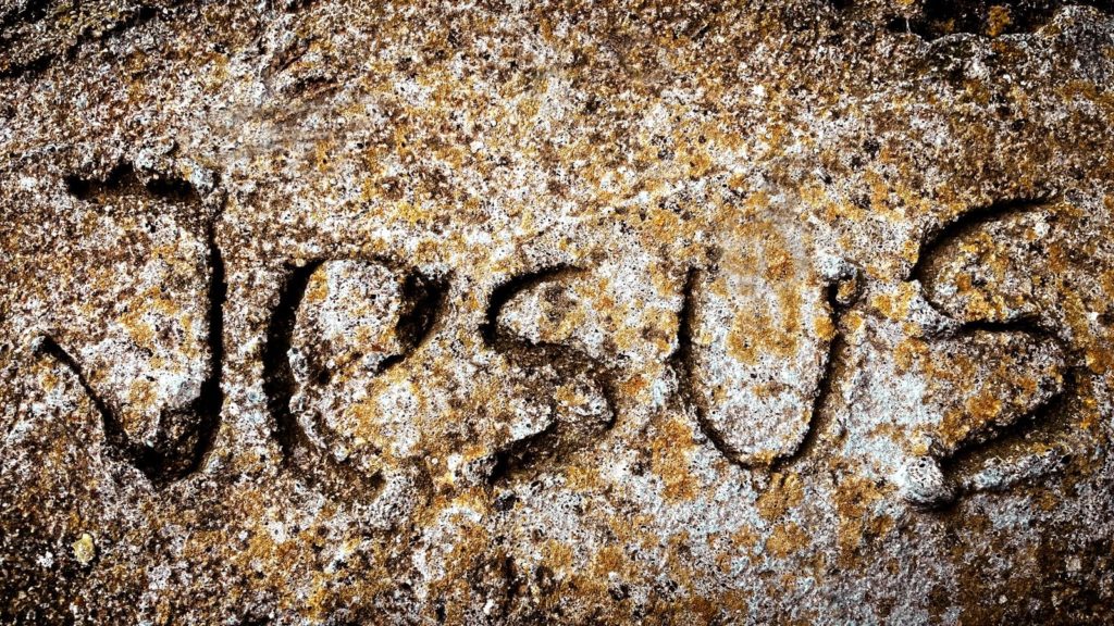 a close up of a rock with writing on it